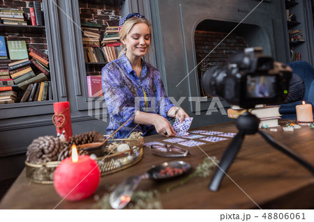 Delighted positive young woman predicting the future 48806061