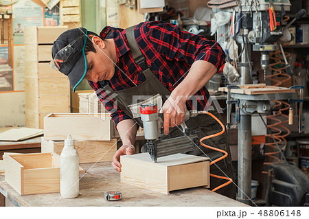 Worker making the wood box Worker making the wood box 48806148