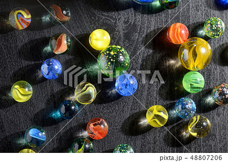 Glass marble balls and shadows 48807206