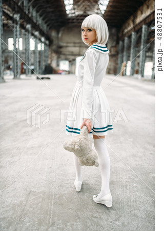 Cute anime style blonde woman with toy bear Cute anime style blonde woman with toy bear 48807531