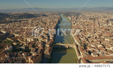 Aerial view of famous Ponte Vecchio and other bridges over Arno river in Florence, Italy 48807575