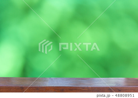 Empty wood table top on  Abstract Blurred green 48808951