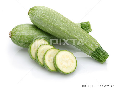 Green zucchini with slices isolated on white Green zucchini with slices isolated on white 48809537