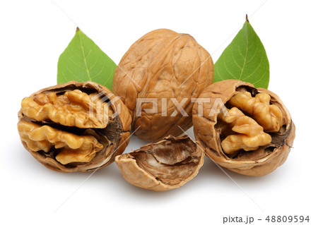 Walnut and cracked walnut with leaf isolated 48809594