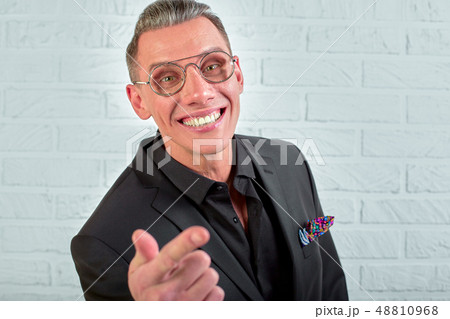 Closeup portrait of a happy young businessman with glasses looking at the camera on white background 48810968