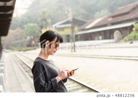 Asian beauty using a smart phone 48812256