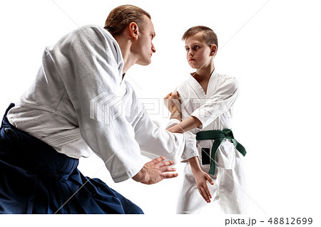 Man and teen boy fighting at aikido training in martial arts school 48812699