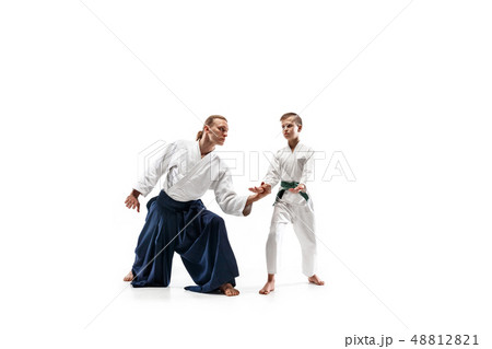 Man and teen boy fighting at aikido training in martial arts school 48812821