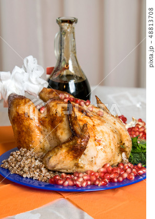 whole fried chicken with buckwheat and pomegranate whole fried chicken with buckwheat and pomegranate 48813708