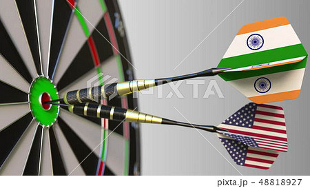 Flags of India and the USA on darts hitting bullseye of the target. International cooperation or Flags of India and the USA on darts hitting bullseye of the target. International cooperation or 48818927