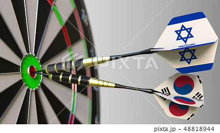 Flags of Israel and Korea on darts hitting bullseye of the target. International cooperation or Flags of Israel and Korea on darts hitting bullseye of the target. International cooperation or 48818944