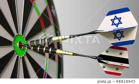 Flags of Israel and Syria on darts hitting bullseye of the target. International cooperation or Flags of Israel and Syria on darts hitting bullseye of the target. International cooperation or 48818945