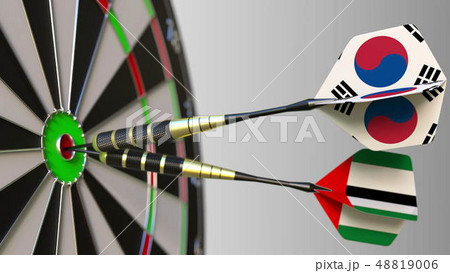 Flags of South Korea and the UAE on darts hitting bullseye of the target. International cooperation Flags of South Korea and the UAE on darts hitting bullseye of the target. International cooperation 48819006