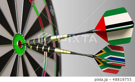 Flags of the UAE and South Africa on darts hitting bullseye of the target. International cooperation 48819755