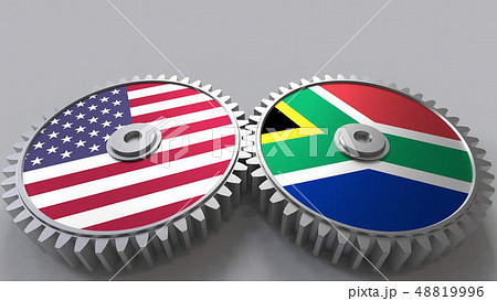 Flags of the USA and South Africa on meshing gears. International cooperation conceptual 3D 48819996