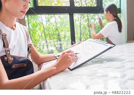 Professional cleaning service team working with 48822222