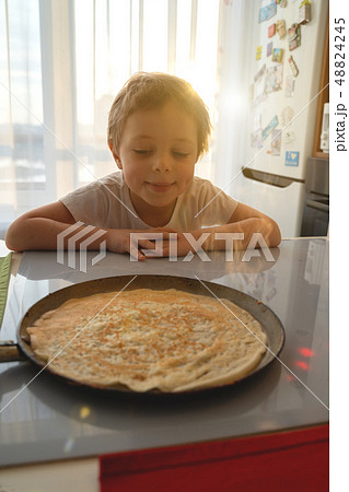 Child fell asleep at Breakfast. Pancake day 48824245