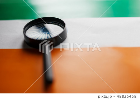 The Indian flag is visible through a magnifying The Indian flag is visible through a magnifying 48825458