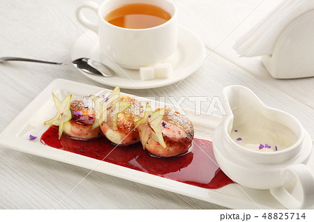 Cottage cheese pancakes with strawberry jam, sour cream on white wooden background, breakfast or Cottage cheese pancakes with strawberry jam, sour cream on white wooden background, breakfast or 48825714