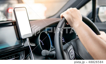 Driver using mobile app for GPS navigation 48826584