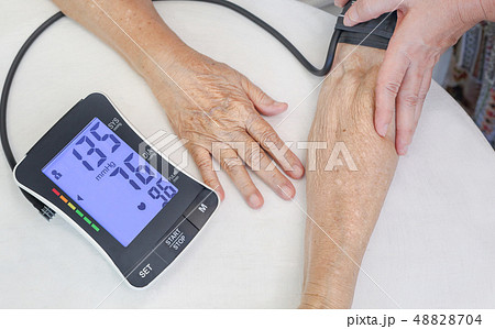 High blood pressure of elderly woman High blood pressure of elderly woman 48828704