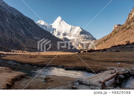 Sacred snow mountain Yangmaiyong reflection on 48829588