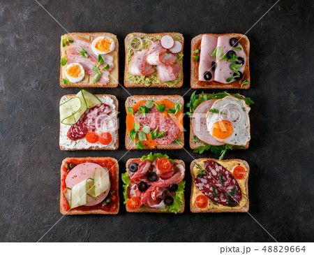 open sandwiches with different meat, copy space 48829664