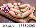 Cooking raw sausages 48830693
