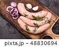 Cooking raw sausages 48830694