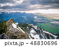 Scenic landscape overlooking snowy mountains 48830696
