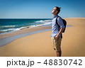 Happy young man in blue shirt 48830742