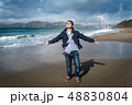 Young man standing on the beach 48830804