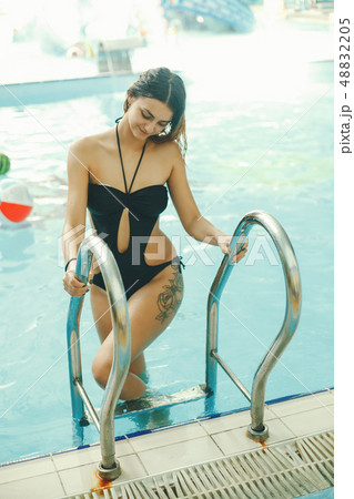 girl in a pool 48832205