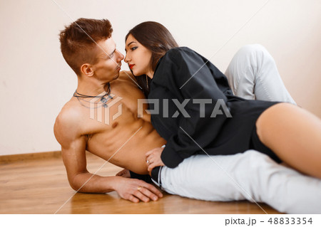 Young couple in love. Beautiful young girl lying 48833354