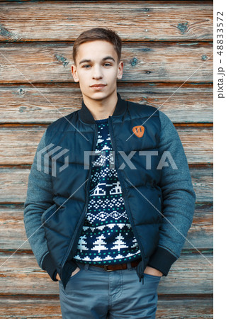 Stylish young man standing Stylish young man standing 48833572