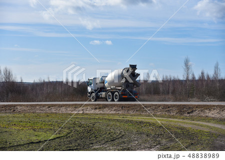Car mixer goes on road in spring Car mixer goes on road in spring 48838989