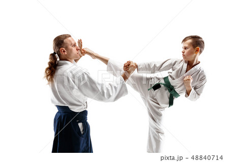 Man and teen boy fighting at aikido training in martial arts school 48840714