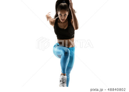 Young african woman running or jogging isolated on white studio background. 48840802