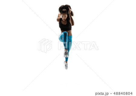 Young african woman running or jogging isolated on white studio background. 48840804