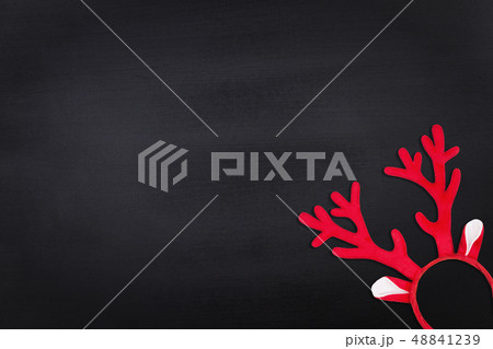 Antlers of a deer headband on chalkboard background. Flat lay 48841239