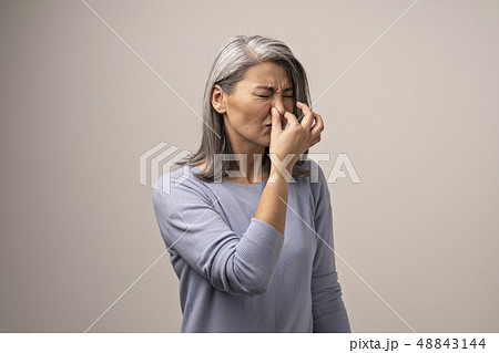 A Gray-Haired Mongolian Woman Unhappy with An Unpleasant Smell. 48843144