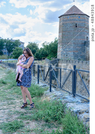 Mom dressed up with a little daughter on the walls Mom dressed up with a little daughter on the walls 48843918