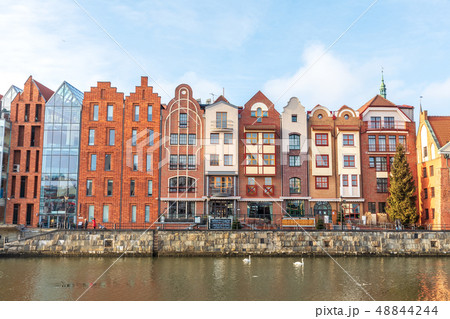 Beautiful facades of the buildings in Gdansk by the river, Poland Beautiful facades of the buildings in Gdansk by the river, Poland 48844244