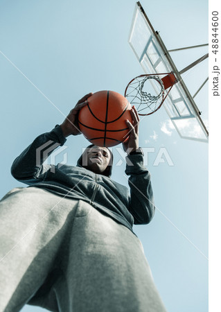 Low angle of an orange basketball ball 48844600