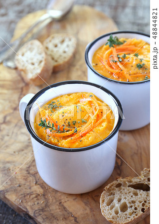 Vegetable carrot soup and bread, two portions Vegetable carrot soup and bread, two portions 48844821