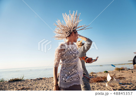 Woman with white dreadlocks dancing with her man near the river 48845357
