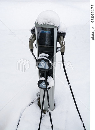 EV charging station for zero emission cars on white snow background 48846177