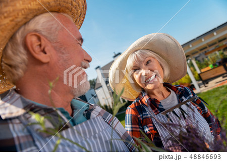 Pleasant nice man and woman looking at each other 48846693