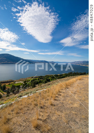 Magnificent view over Okanagan lake and valley with bizarre clouds in the sky. 48847029