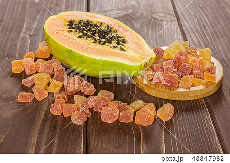 Dry papaya on brown wood 48847982
